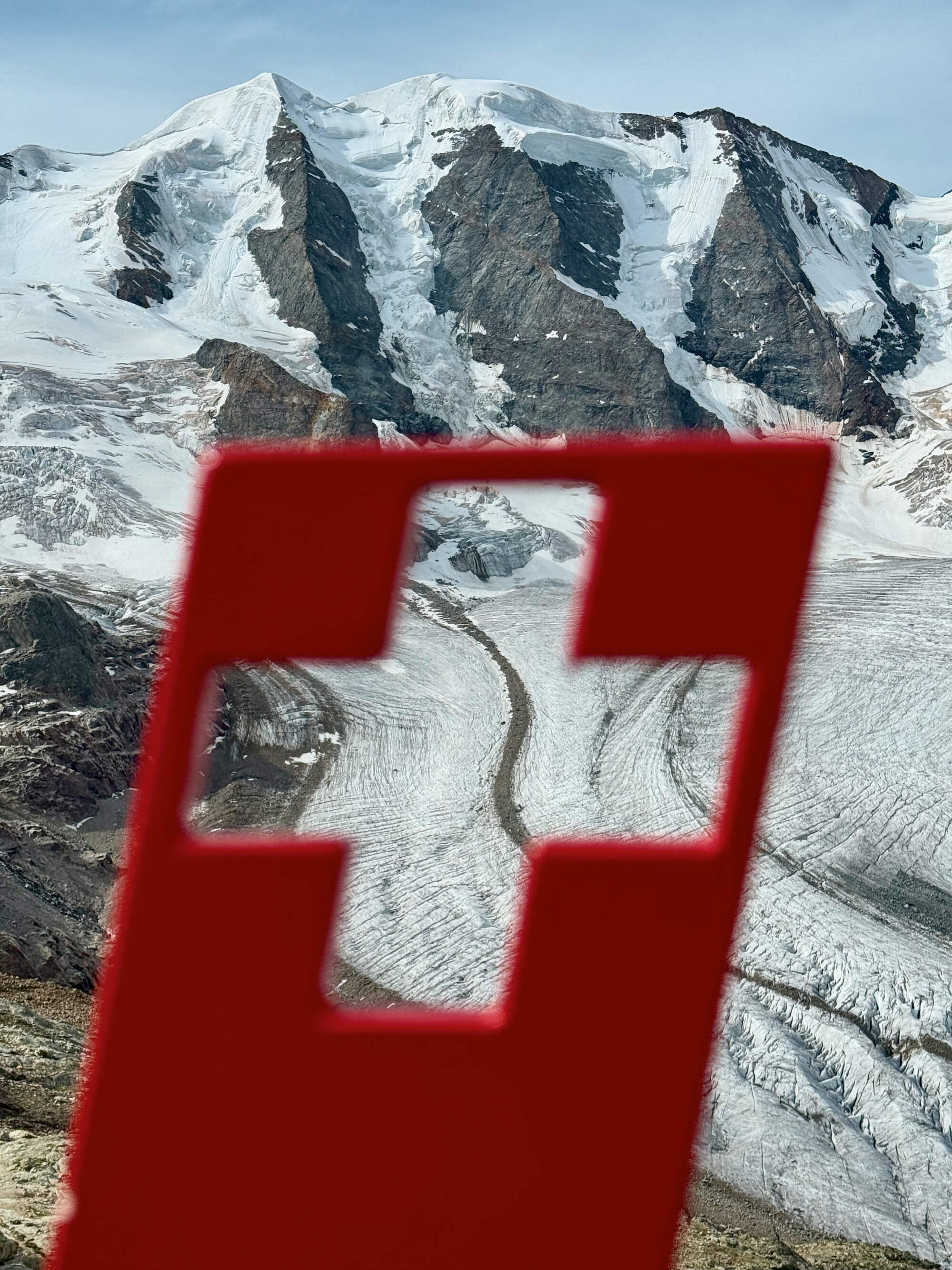 Mountains through the Swiss flag